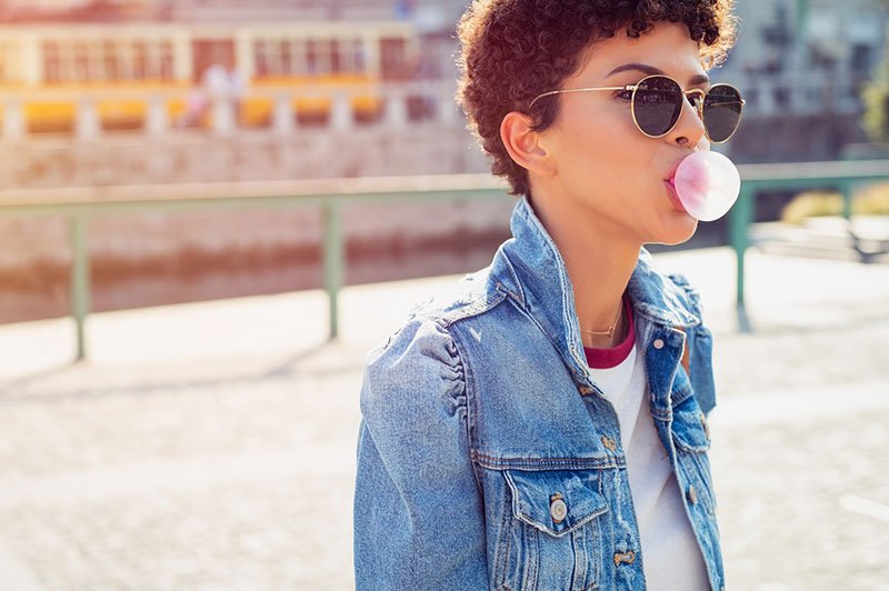 young woman chewing gum
