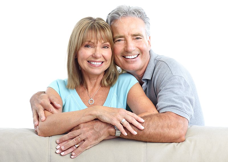 Senior Happy Couple With Dental Implants From Dentistry Revolution